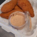 The 4 piece chicken fingers with our signature sauce at our restuarant in the Temiskaming Shores region, close to New Liskeard, Earlton, Cobalt, Kenabeek, Engelhart, etc.
