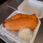 A photo of our Hand Battered Fish Sandwich Sandwich at Loaves and Fishes Family Kitchen in Temiskaming Shores. Seving New Liskeard, Haileybury, Cobalt, Earlton, Engelhart, and more.
