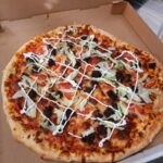 Pizza in Temiskaming Shores and New Liskeard. A photo of our taco pizza at Loaves and Fishes Family Kitchen.